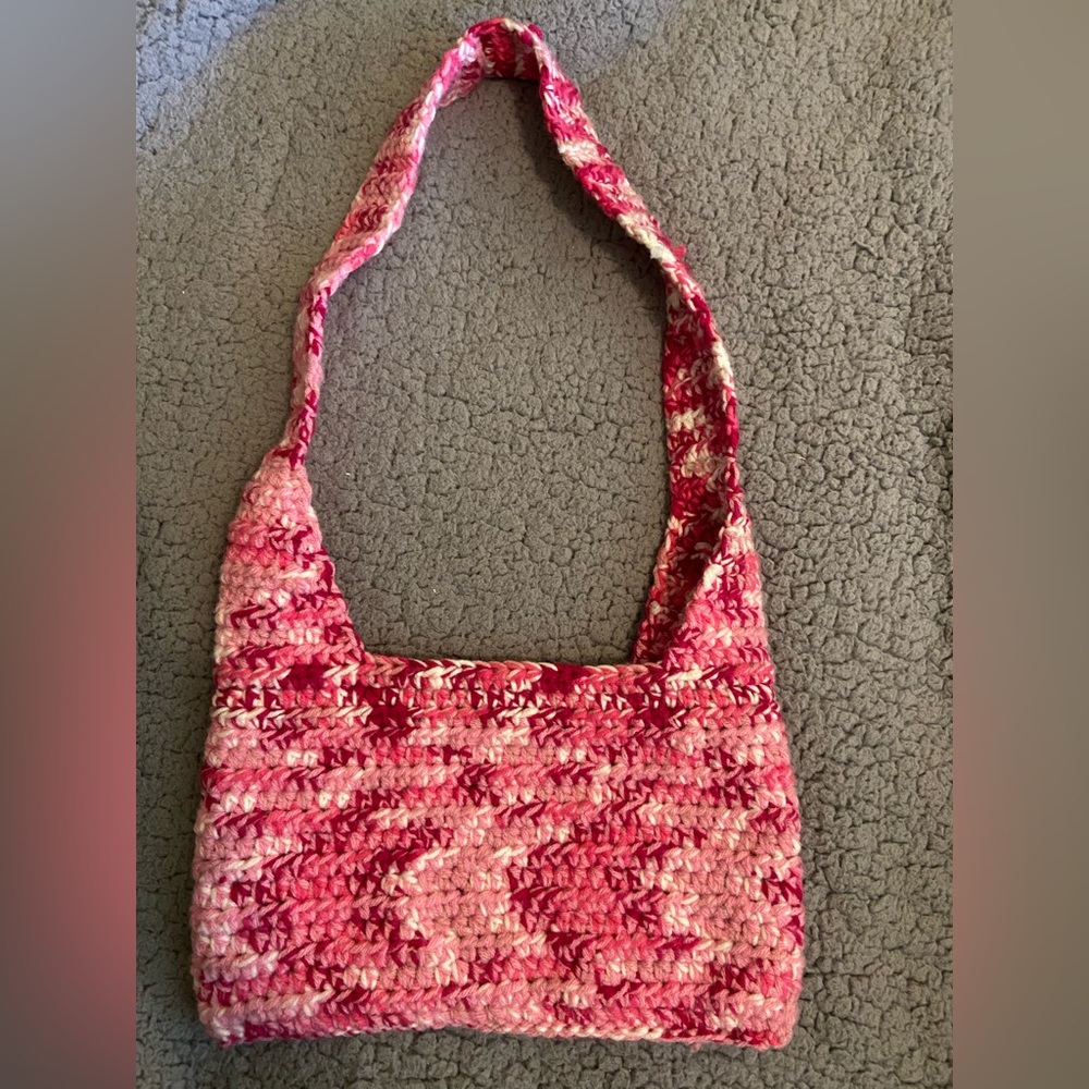 Handmade crocheted bag, 7”x10.5” with around a 13” strap.